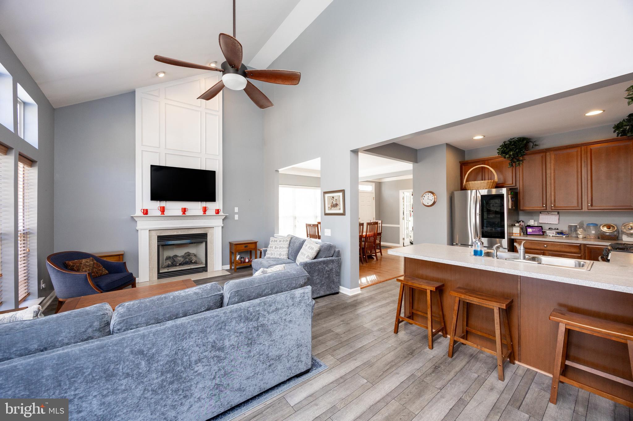 612 Churchill Road Chester Springs, PA 19425 - Photo 5 of 33 a living room with furniture a fireplace and a flat screen tv
