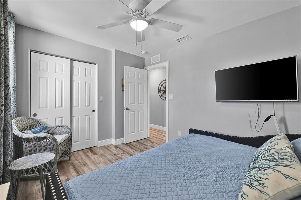 812 Gulf Boulevard, Unit 3 Indian Rocks Beach, FL 33785 - Photo 12 of 62 a bedroom with a bed and a flat screen tv