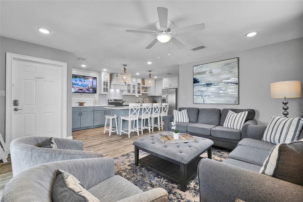 812 Gulf Boulevard, Unit 3 Indian Rocks Beach, FL 33785 - Photo 13 of 62 a living room with furniture and a view of kitchen