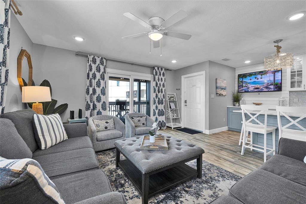812 Gulf Boulevard, Unit 3 Indian Rocks Beach, FL 33785 - Photo 16 of 62 a living room with furniture and a table