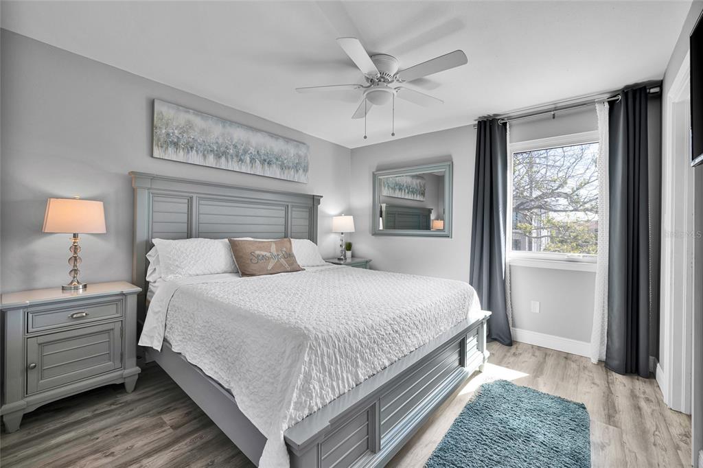 812 Gulf Boulevard, Unit 3 Indian Rocks Beach, FL 33785 - Photo 18 of 62 a bedroom with a large bed and a window