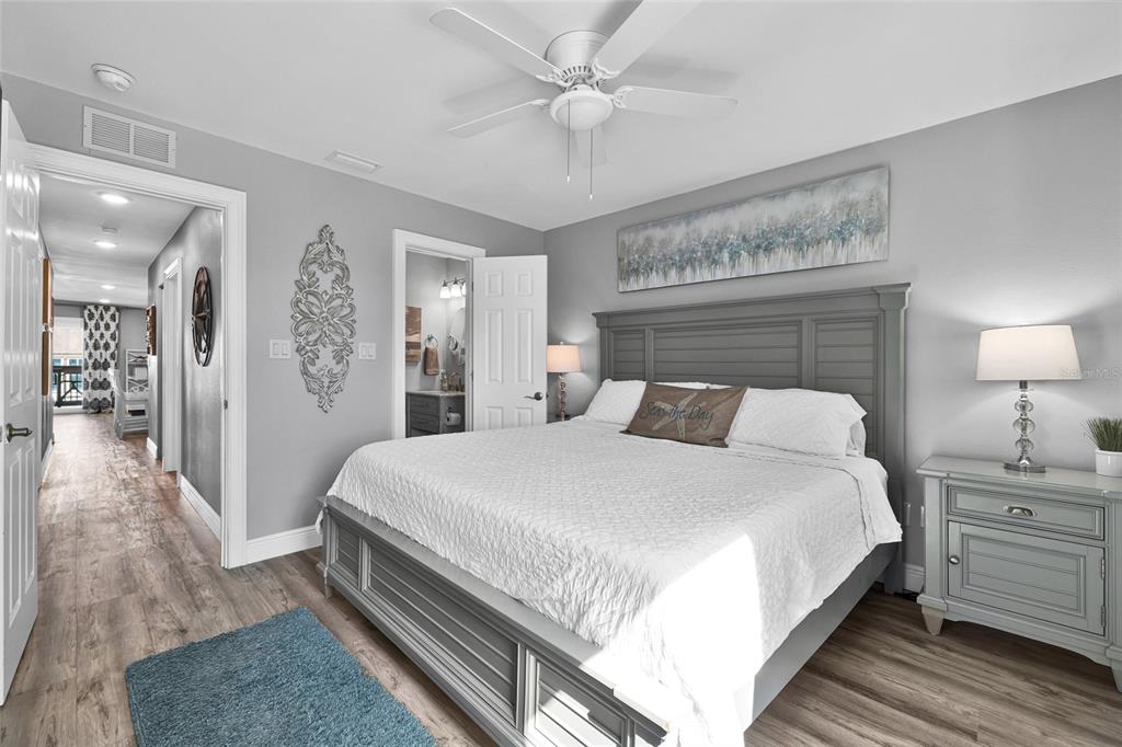 812 Gulf Boulevard, Unit 3 Indian Rocks Beach, FL 33785 - Photo 19 of 62 a bed room with a bed and a walk in closet