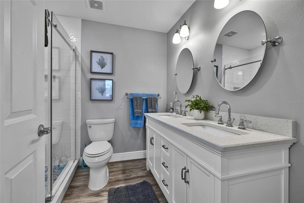 812 Gulf Boulevard, Unit 3 Indian Rocks Beach, FL 33785 - Photo 21 of 62 a bathroom with a sink and a mirror