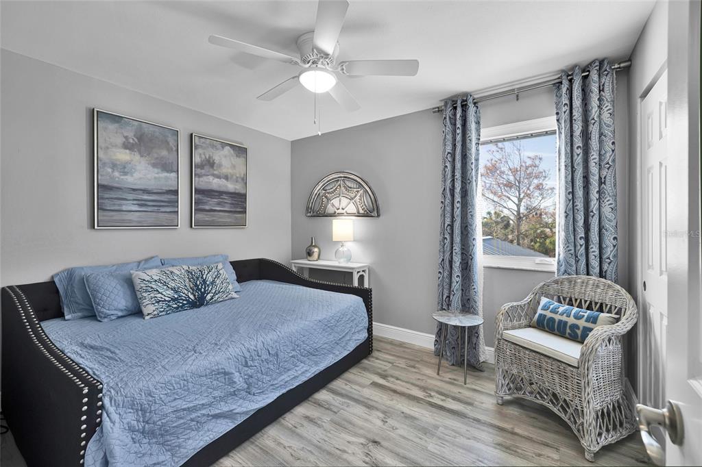 812 Gulf Boulevard, Unit 3 Indian Rocks Beach, FL 33785 - Photo 23 of 62 a bedroom with a large bed and a window