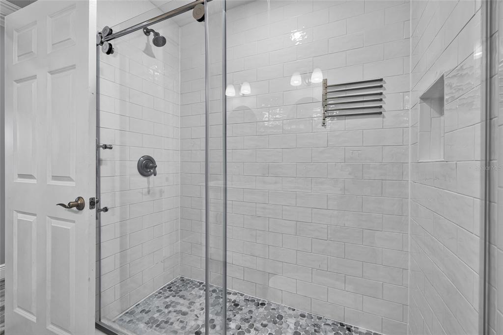 812 Gulf Boulevard, Unit 3 Indian Rocks Beach, FL 33785 - Photo 26 of 62 a bathroom with a shower and a sink