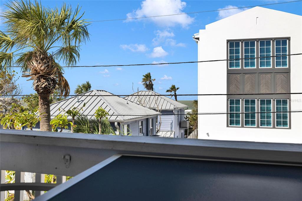 812 Gulf Boulevard, Unit 3 Indian Rocks Beach, FL 33785 - Photo 31 of 62 a view of balcony with two potted plants