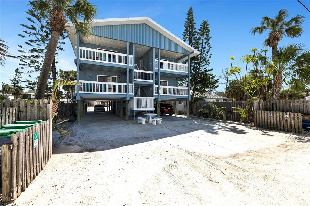 812 Gulf Boulevard, Unit 3 Indian Rocks Beach, FL 33785 - Photo 38 of 62 a view of a house with a yard