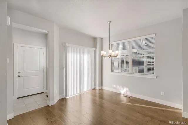 a view of a brick house with large windows