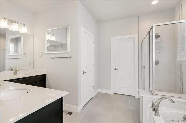 a kitchen with a sink dishwasher a stove and cabinets