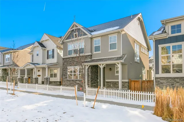 a view of a brick house with many windows