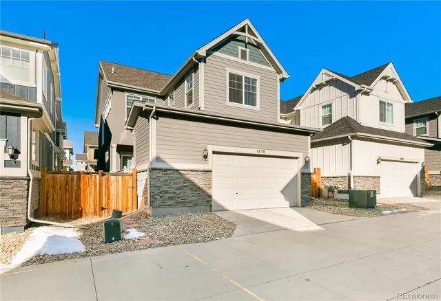 a view of a white house with large windows