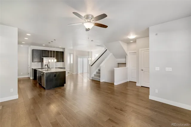 a view of kitchen with sink and wooden floor