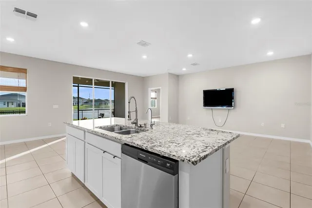 a kitchen with a sink and a refrigerator
