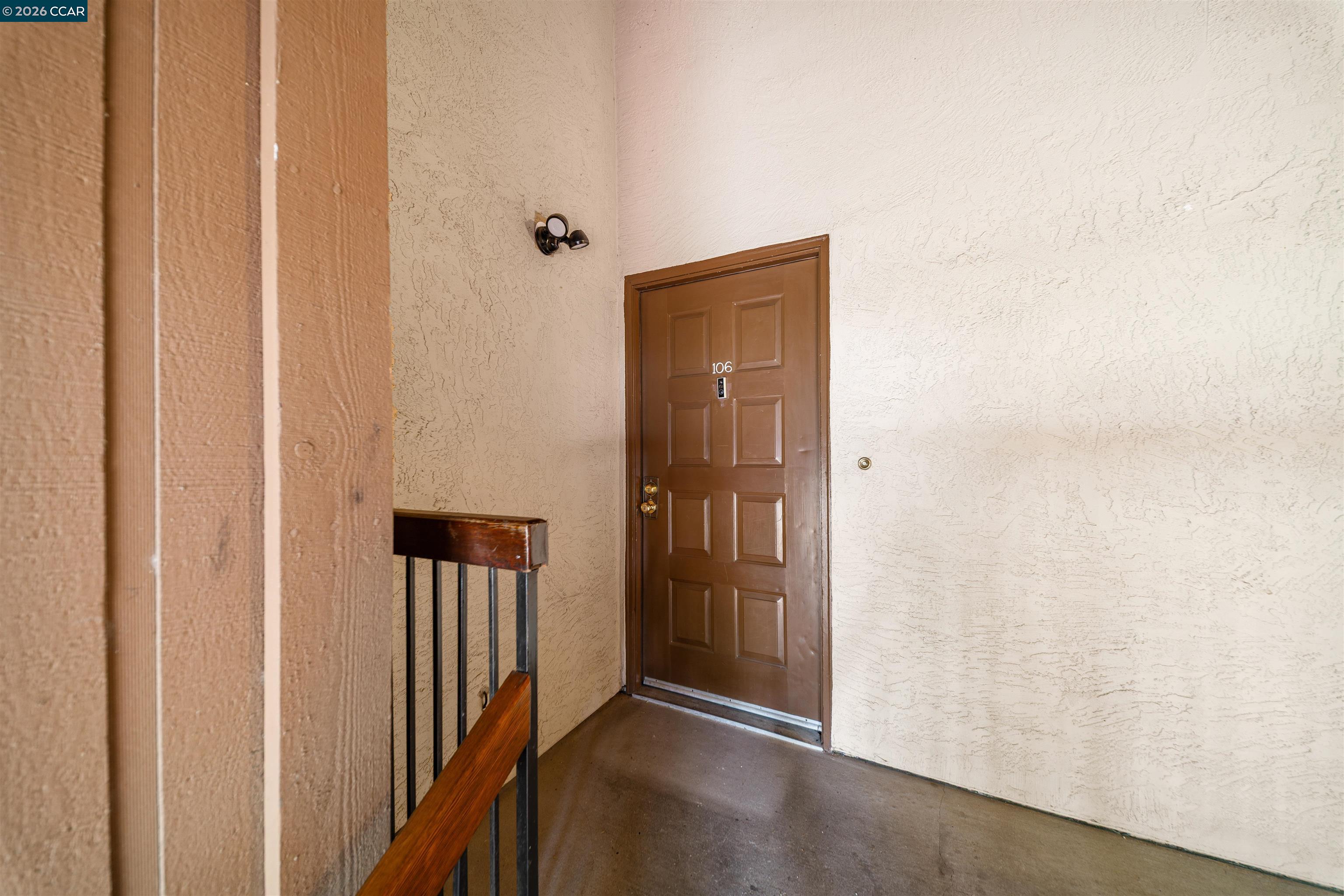 2055 Sierra Road, Unit 106 Concord, CA 94518 - Photo 26 of 37 a view of a hallway with wooden floor