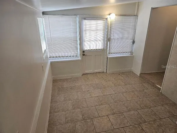 a view of an empty room with a window