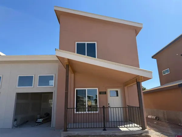 a front view of a house with a garage