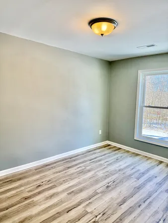 wooden floor and window in a room