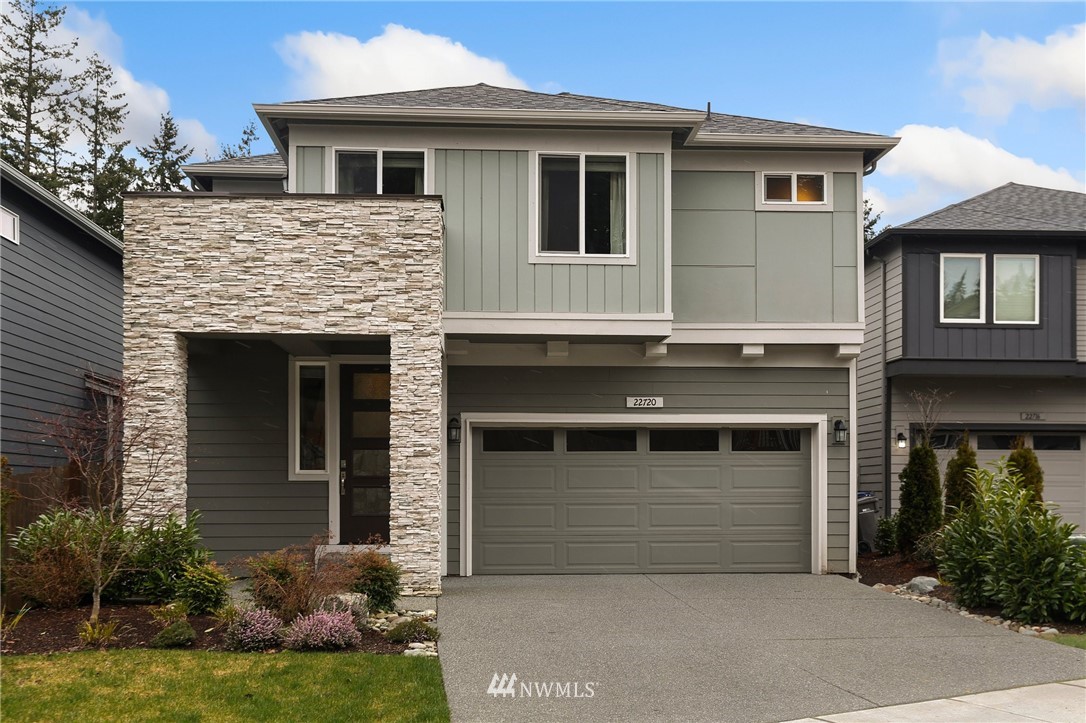 22720 41st Drive Southeast Bothell, WA 98021 - Photo 1 of 33 a front view of a house with garden