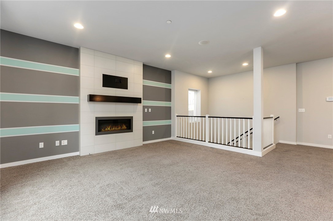 22720 41st Drive Southeast Bothell, WA 98021 - Photo 2 of 33 a view of an empty room with a fireplace