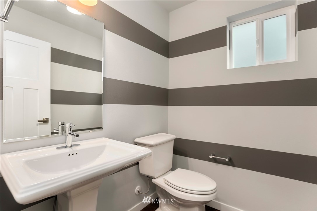 22720 41st Drive Southeast Bothell, WA 98021 - Photo 12 of 33 a bathroom with a sink a toilet and a mirror