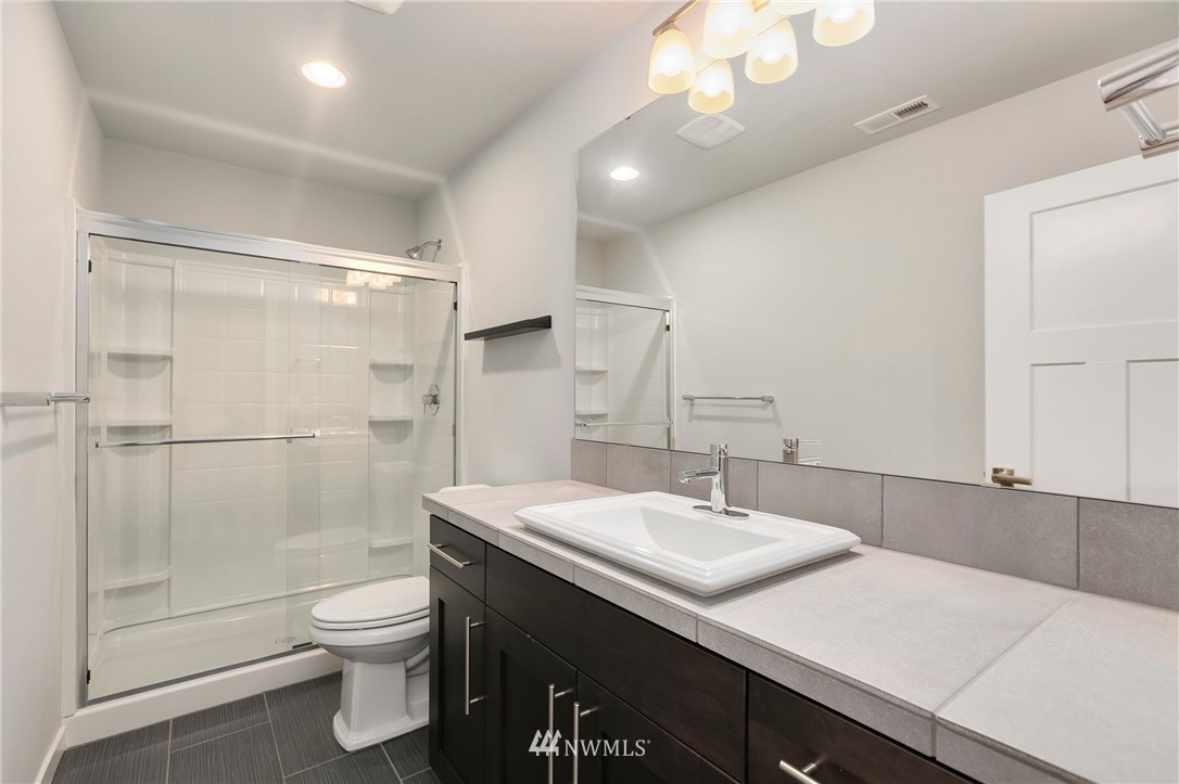 22720 41st Drive Southeast Bothell, WA 98021 - Photo 16 of 33 a bathroom with a sink toilet and shower