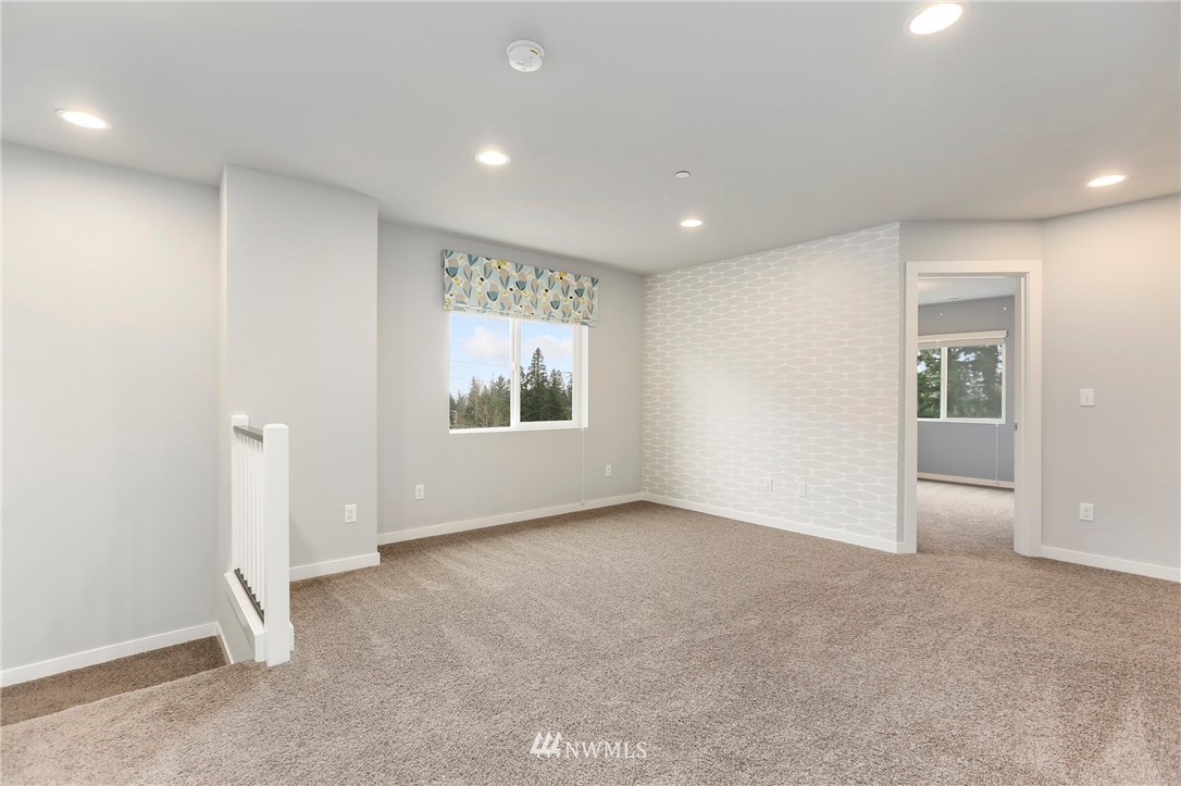 22720 41st Drive Southeast Bothell, WA 98021 - Photo 22 of 33 an empty room with windows and closet