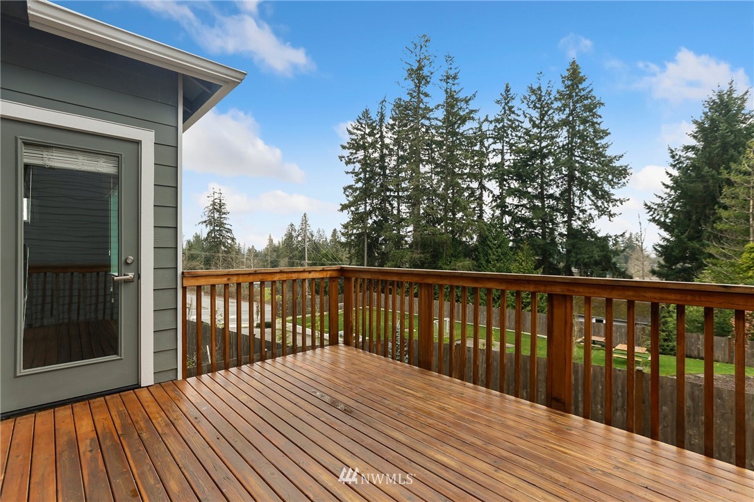 22720 41st Drive Southeast Bothell, WA 98021 - Photo 29 of 33 a balcony with wooden floor and fence