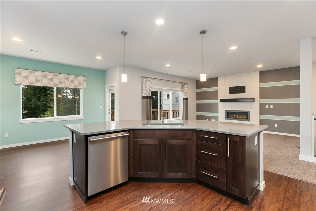 22720 41st Drive Southeast Bothell, WA 98021 - Photo 6 of 33 a kitchen with a sink window and cabinets