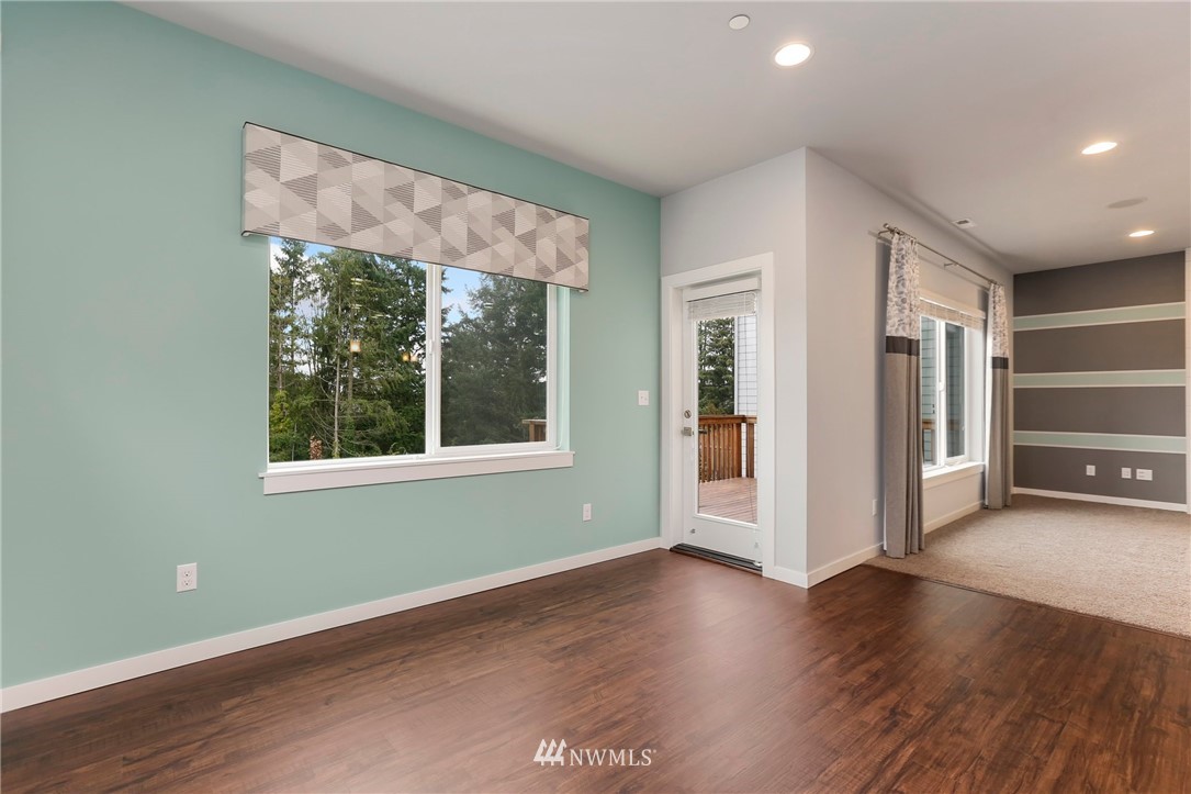 22720 41st Drive Southeast Bothell, WA 98021 - Photo 10 of 33 wooden floor in an empty room with a window