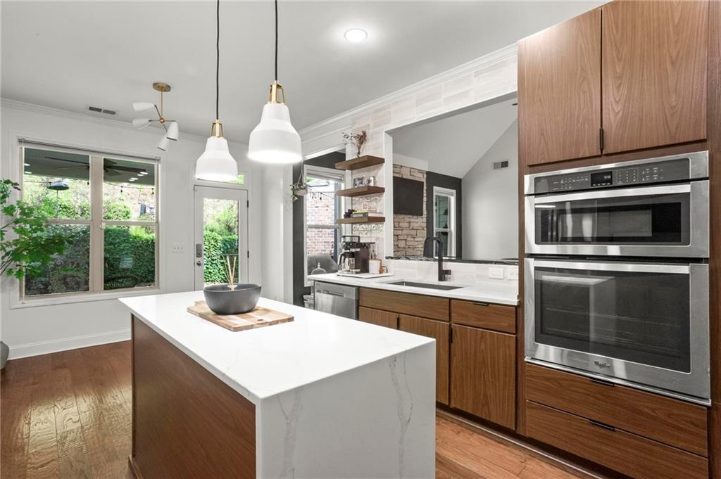 183 Lullwater Lane Dallas, GA 30132 - Photo 15 of 40 a kitchen with a stove a sink and a microwave