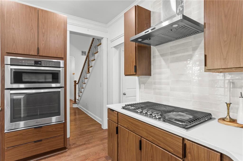 183 Lullwater Lane Dallas, GA 30132 - Photo 16 of 40 a kitchen with granite countertop a stove and a sink