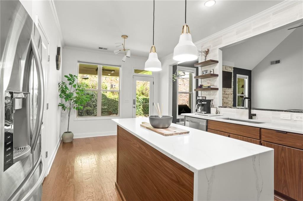 183 Lullwater Lane Dallas, GA 30132 - Photo 17 of 40 a kitchen with a sink stove and wooden floor