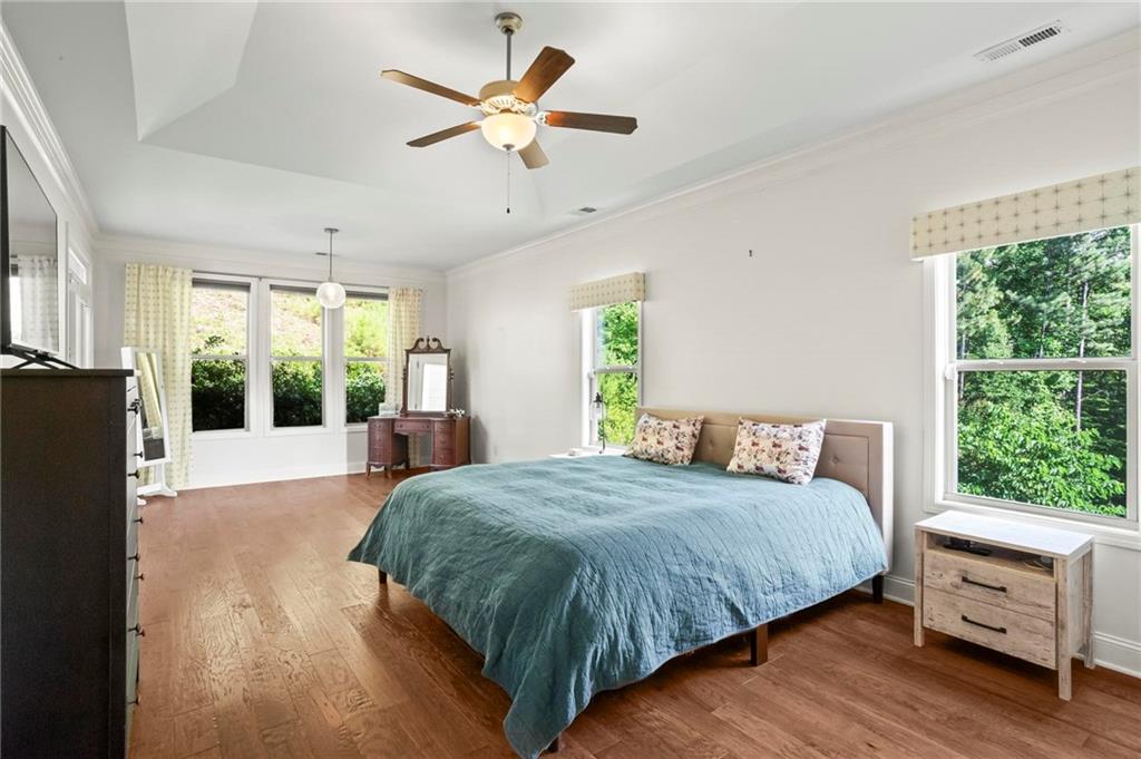 183 Lullwater Lane Dallas, GA 30132 - Photo 19 of 40 a bedroom with a large bed and a large window