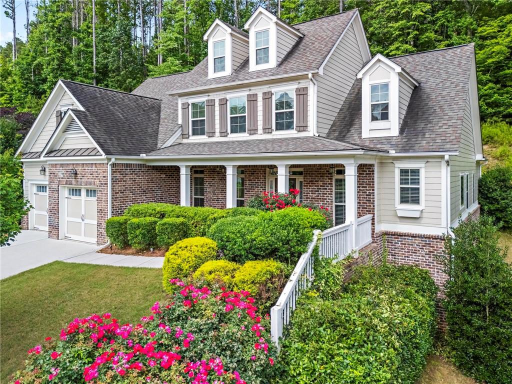183 Lullwater Lane Dallas, GA 30132 - Photo 2 of 40 a front view of a house with garden and porch