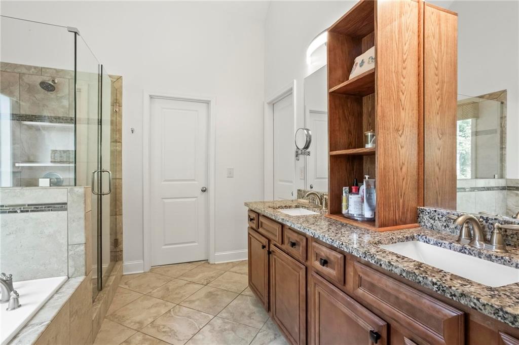 183 Lullwater Lane Dallas, GA 30132 - Photo 22 of 40 a bathroom with a granite countertop sink and a mirror