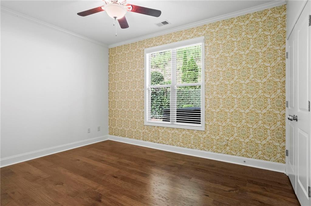 183 Lullwater Lane Dallas, GA 30132 - Photo 25 of 40 a view of an empty room with wooden floor and a window