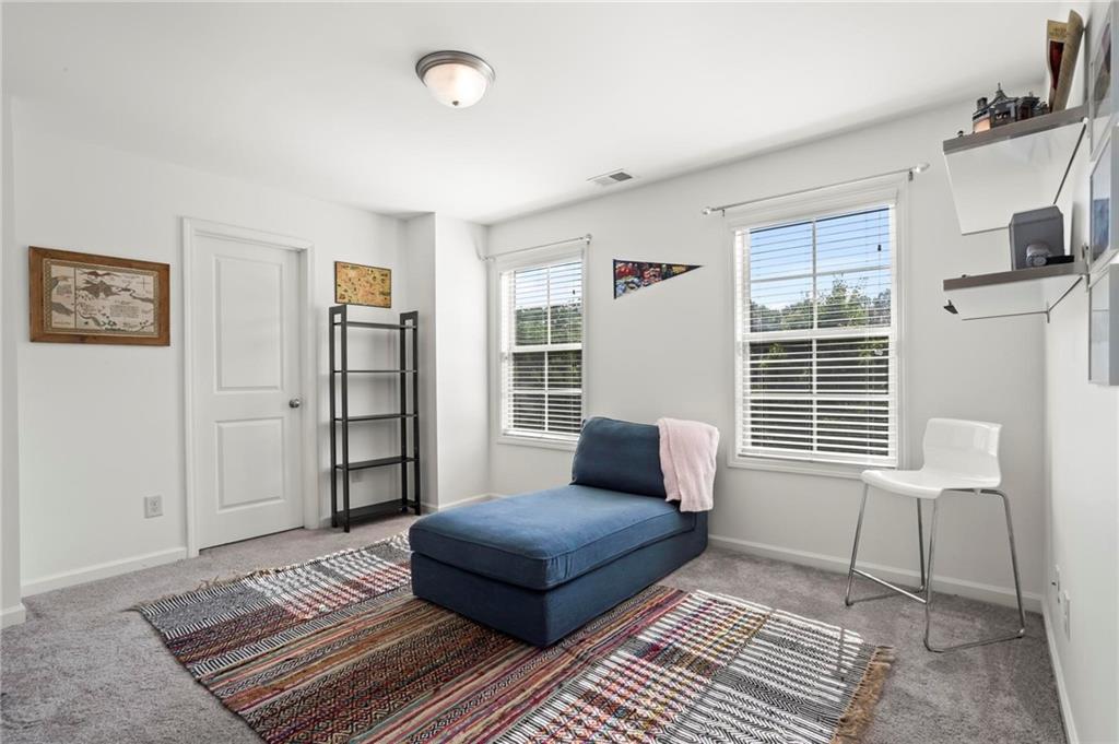 183 Lullwater Lane Dallas, GA 30132 - Photo 27 of 40 a living room with furniture and a window