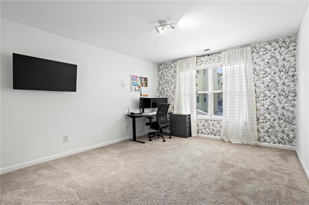 183 Lullwater Lane Dallas, GA 30132 - Photo 29 of 40 a workspace with furniture and a window