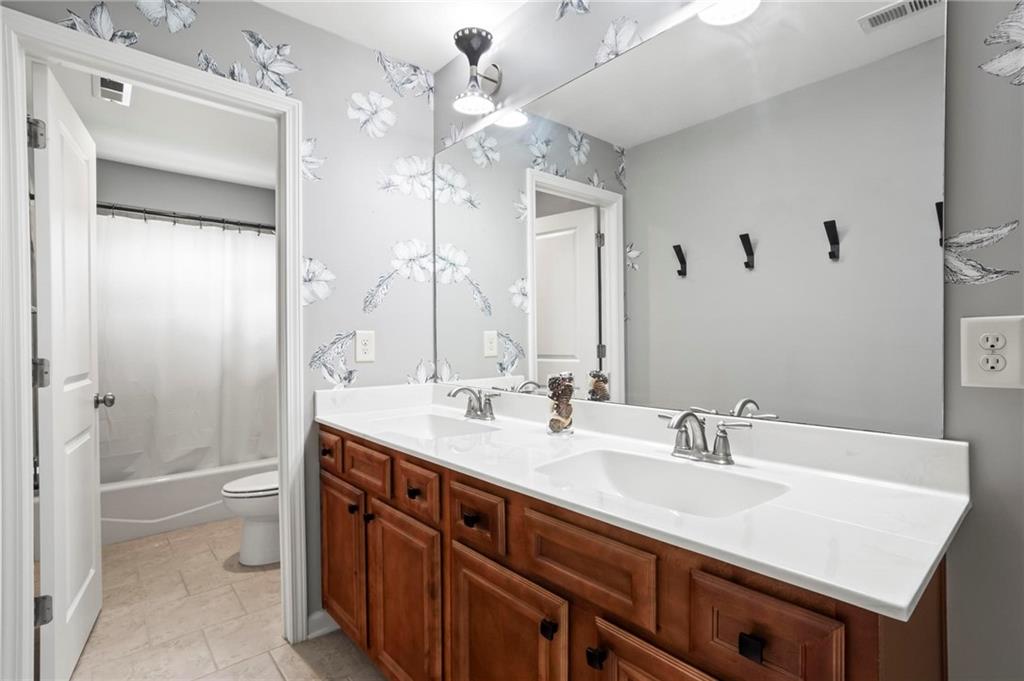 183 Lullwater Lane Dallas, GA 30132 - Photo 30 of 40 a bathroom with a sink vanity granite tub and shower