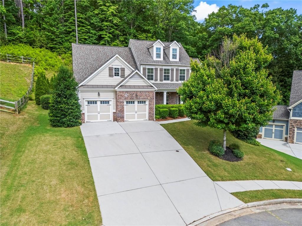 183 Lullwater Lane Dallas, GA 30132 - Photo 37 of 40 a front view of a house with garden