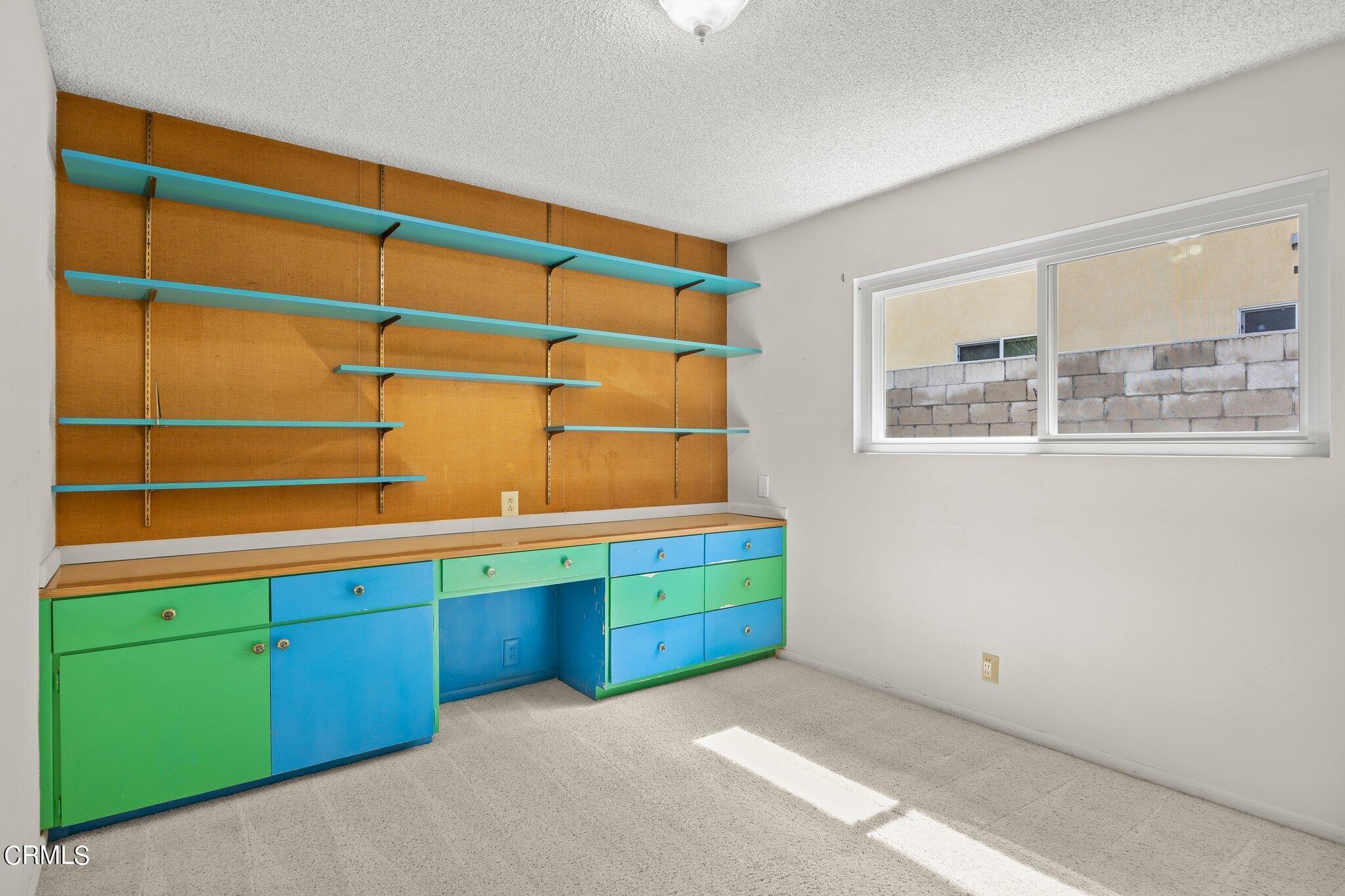 4989 Strickland Drive Oxnard, CA 93036 - Photo 16 of 26 a room with a bed and a window