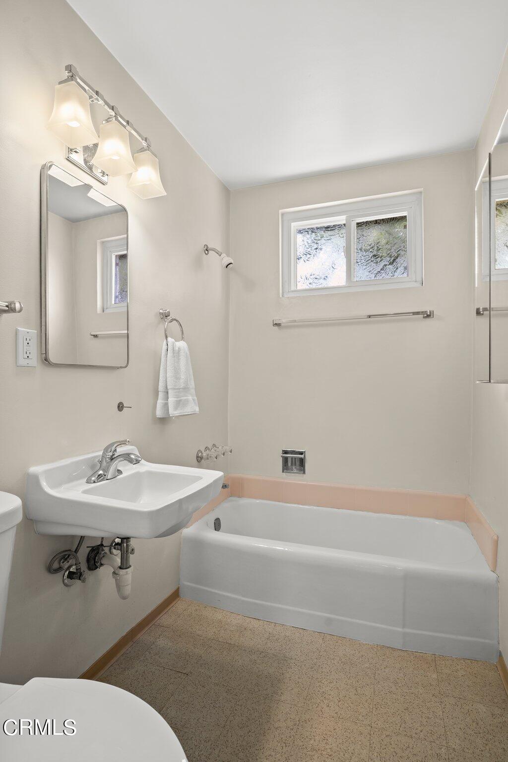 4989 Strickland Drive Oxnard, CA 93036 - Photo 18 of 26 a bathroom with a sink a toilet and a mirror
