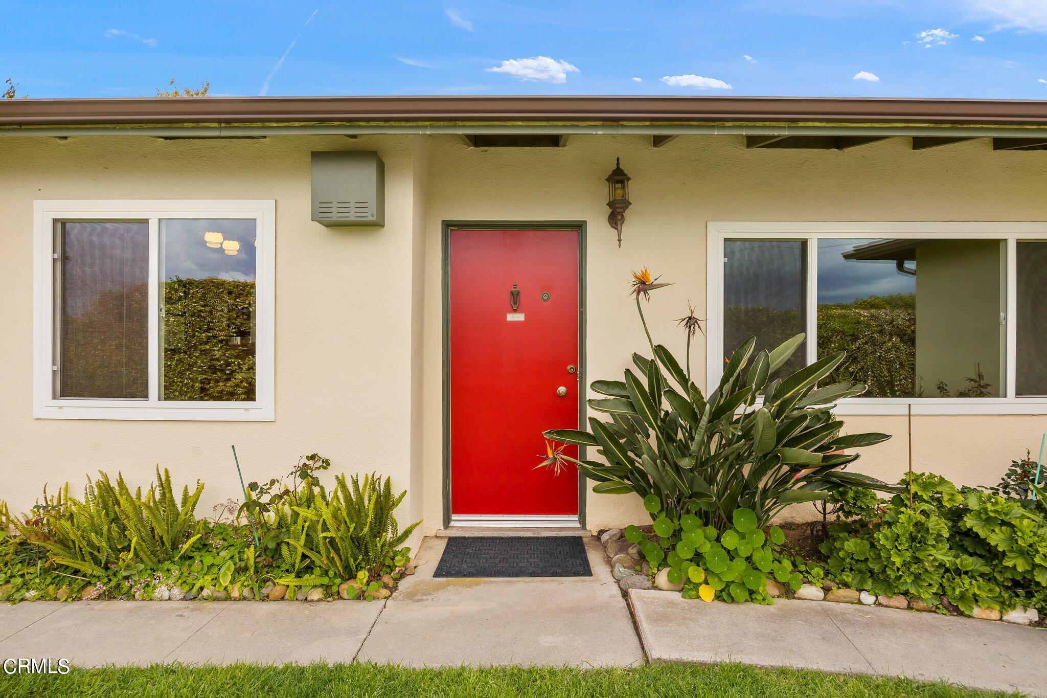 4989 Strickland Drive Oxnard, CA 93036 - Photo 2 of 26 a front view of a house with a yard