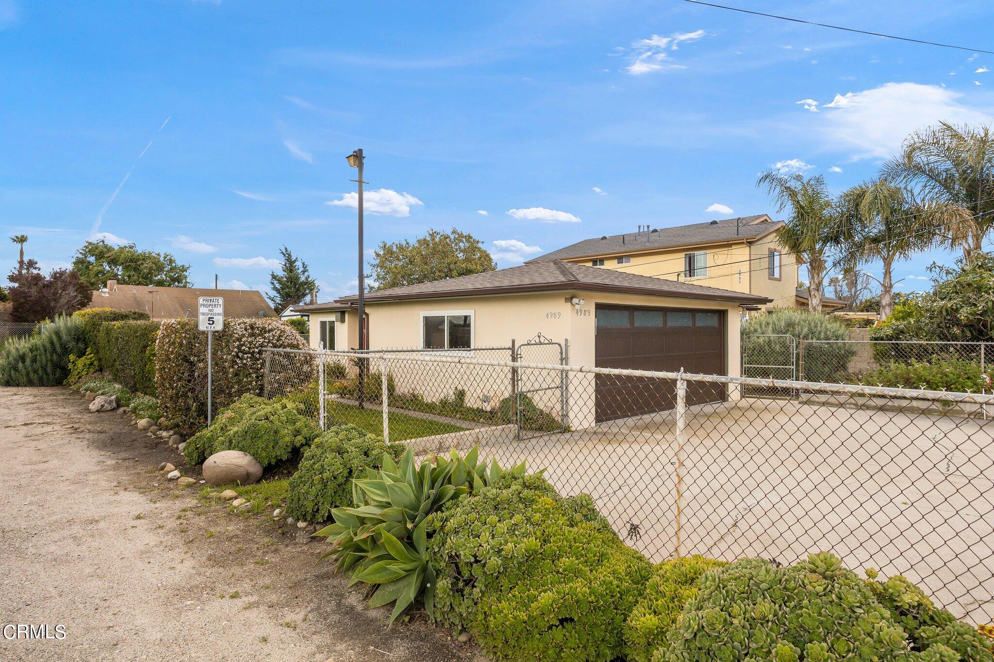 4989 Strickland Drive Oxnard, CA 93036 - Photo 3 of 26 a house view with a backyard space