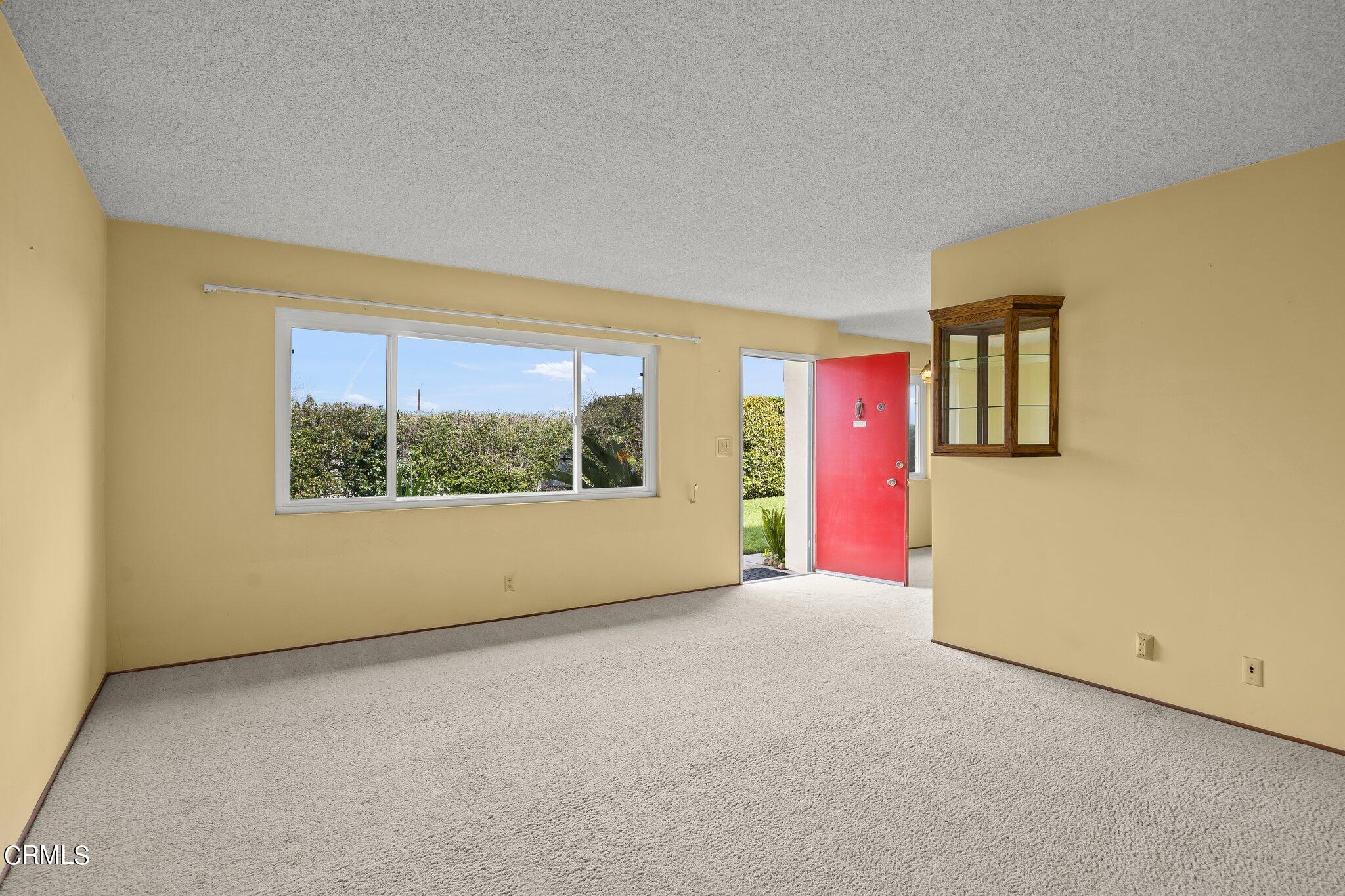 4989 Strickland Drive Oxnard, CA 93036 - Photo 6 of 26 an empty room with a window