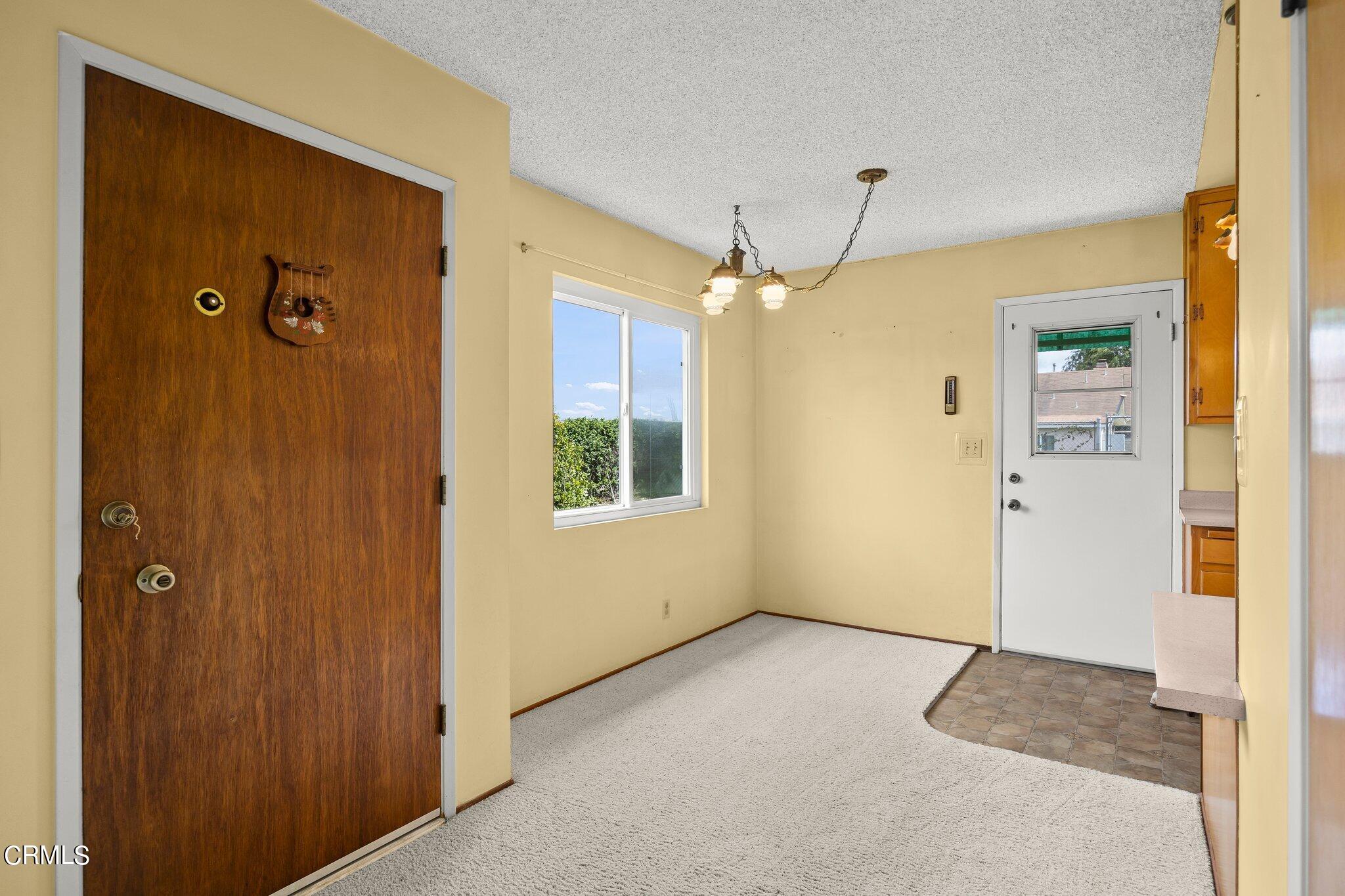 4989 Strickland Drive Oxnard, CA 93036 - Photo 8 of 26 a view of a bathroom with a shower and a mirror