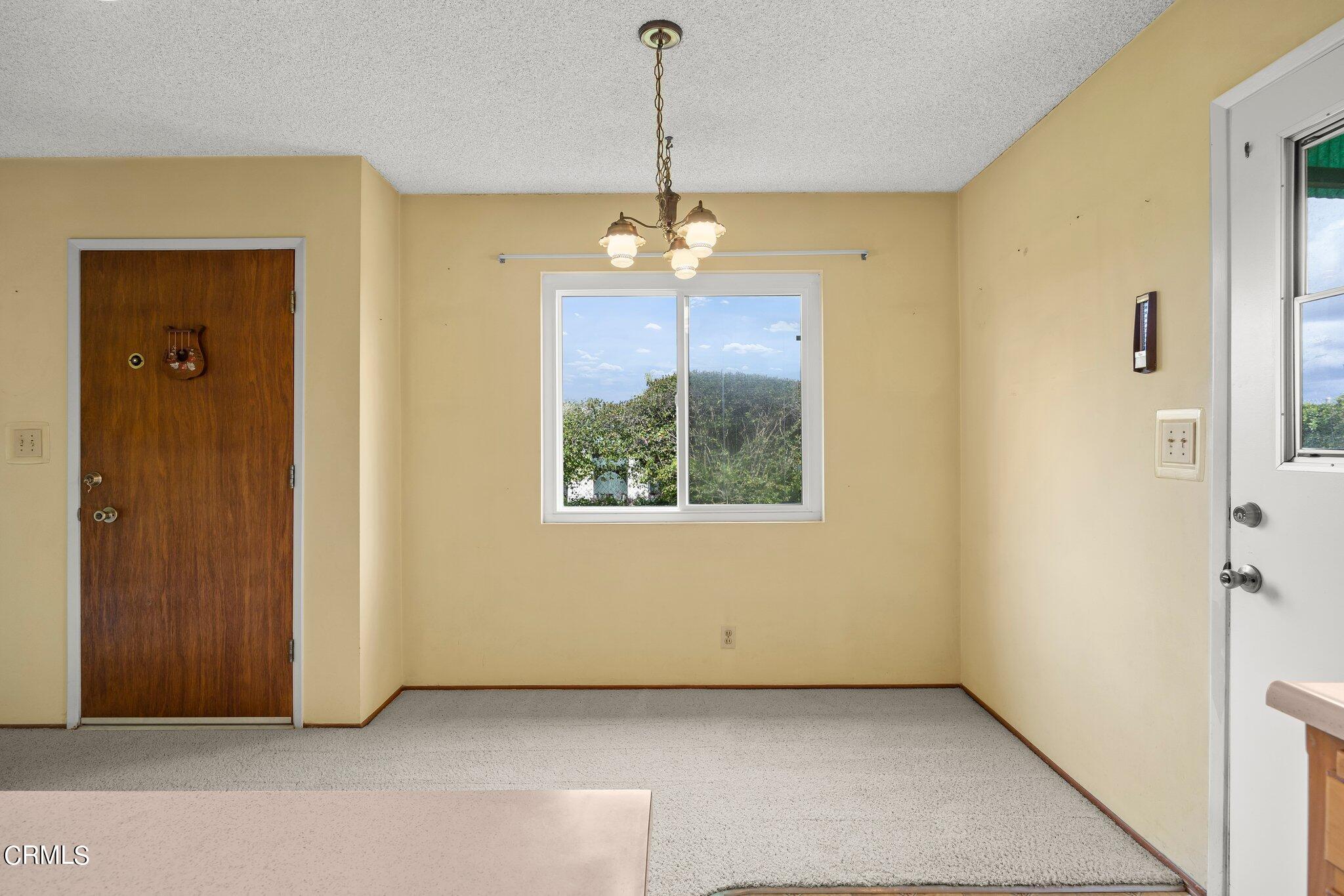 4989 Strickland Drive Oxnard, CA 93036 - Photo 9 of 26 a view of a room with a windows and ceiling fan