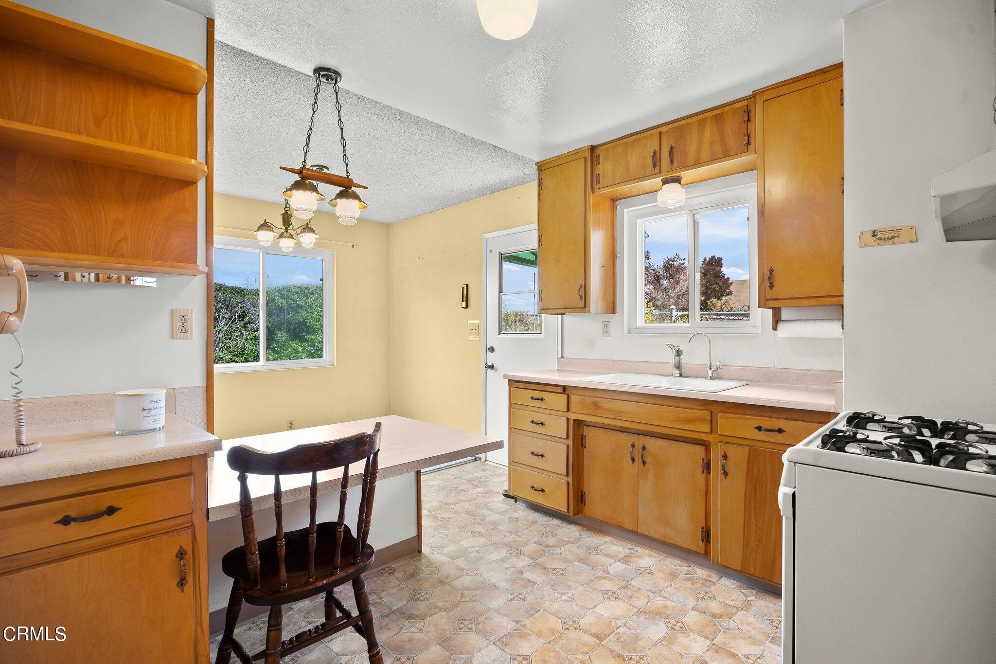 4989 Strickland Drive Oxnard, CA 93036 - Photo 10 of 26 a spacious bathroom with a granite countertop sink a mirror and a bathtub