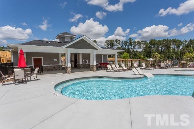 220 Zante Currant Road Durham, NC 27703 - Photo 21 of 24 a view of a house with sitting area and swimming pool
