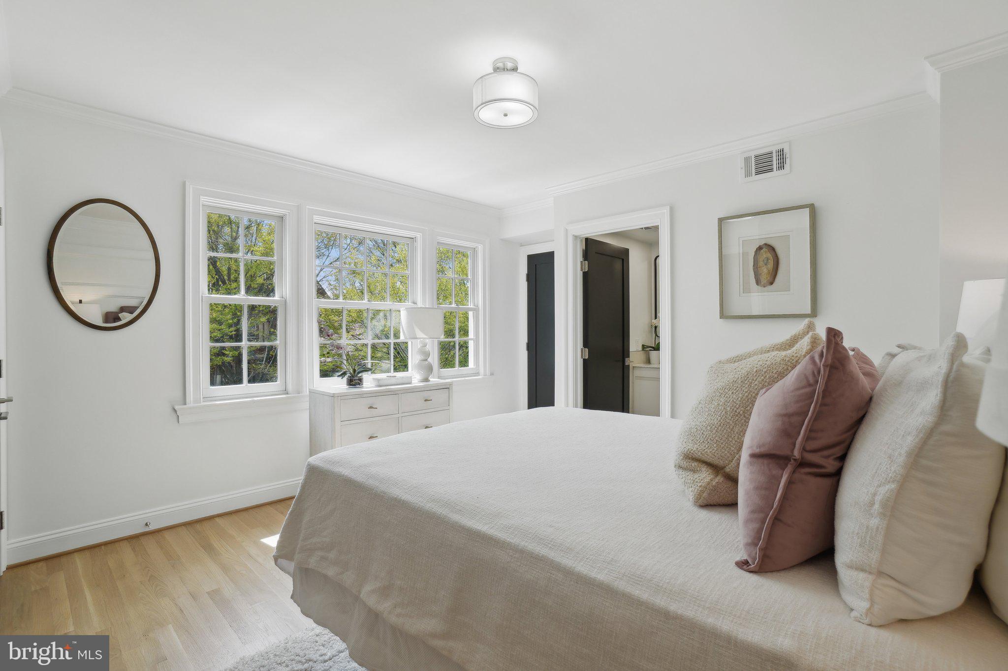 4423 Volta Place Northwest Washington, DC 20007 - Photo 16 of 36 a bedroom with a bed and a large window